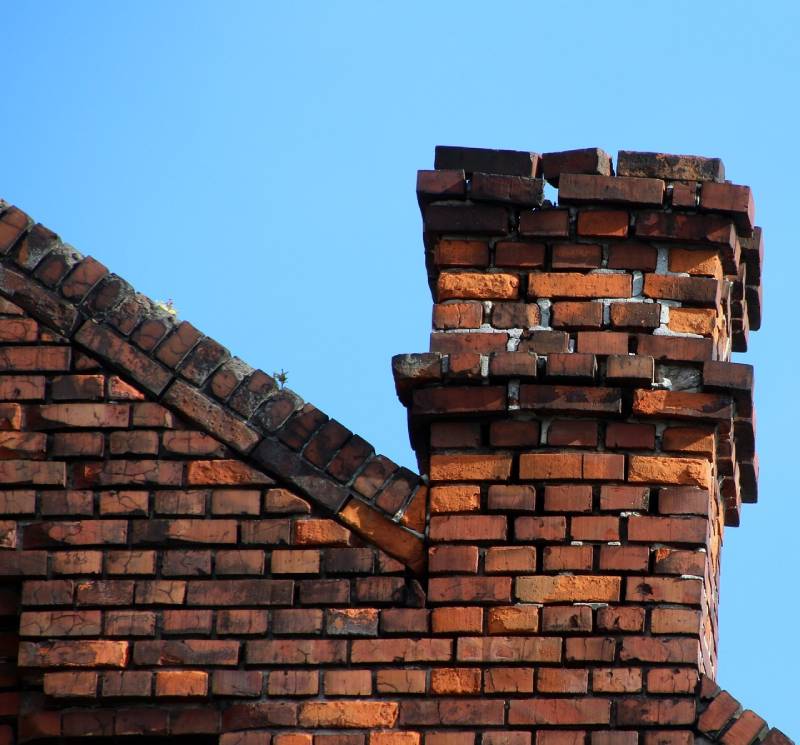 Damaged chimney on an Poway home showing cracks and missing mortar